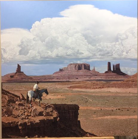 Navajo Skyline by John Bye painting of a cowboy